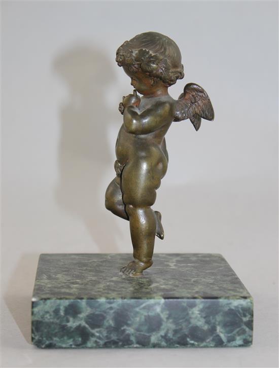 A Continental patinated bronze model of Cupid, 5.5in.